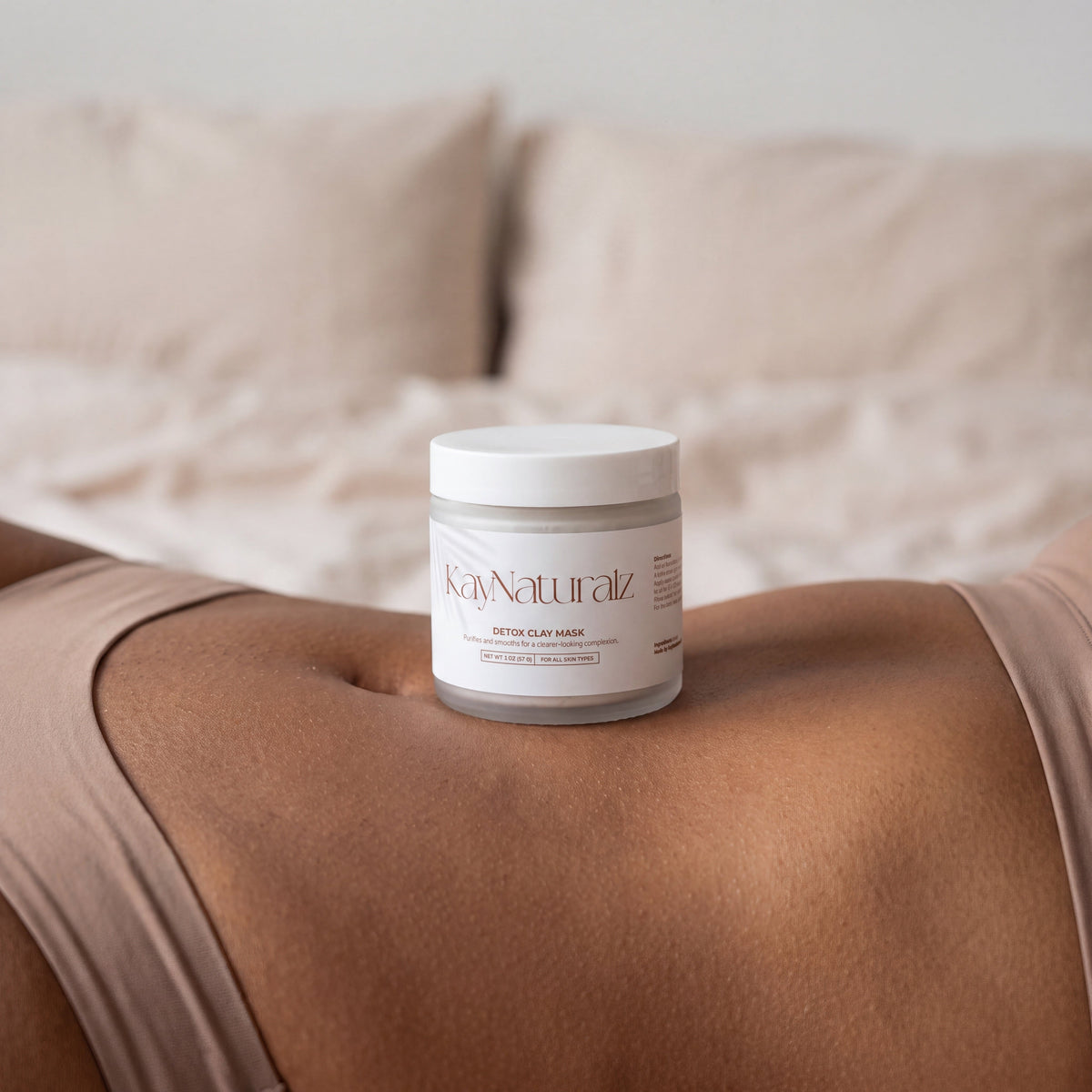 Detox Clay Mask jar in a bedroom setting