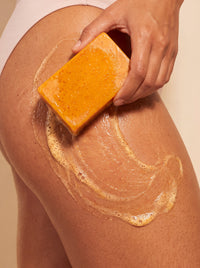Organic Turmeric Soap Bar lathered on skin