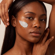 Detox Clay Mask swiped across the cheek