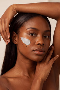 Detox Clay Mask swiped across the cheek